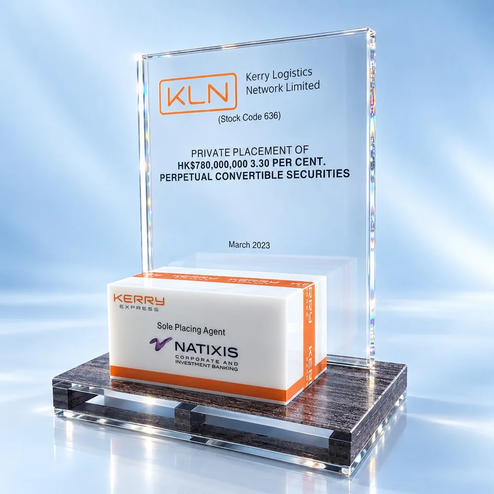 Lucite embedment award holding a branded carton above a crystal pallet base, made by Crystal Century